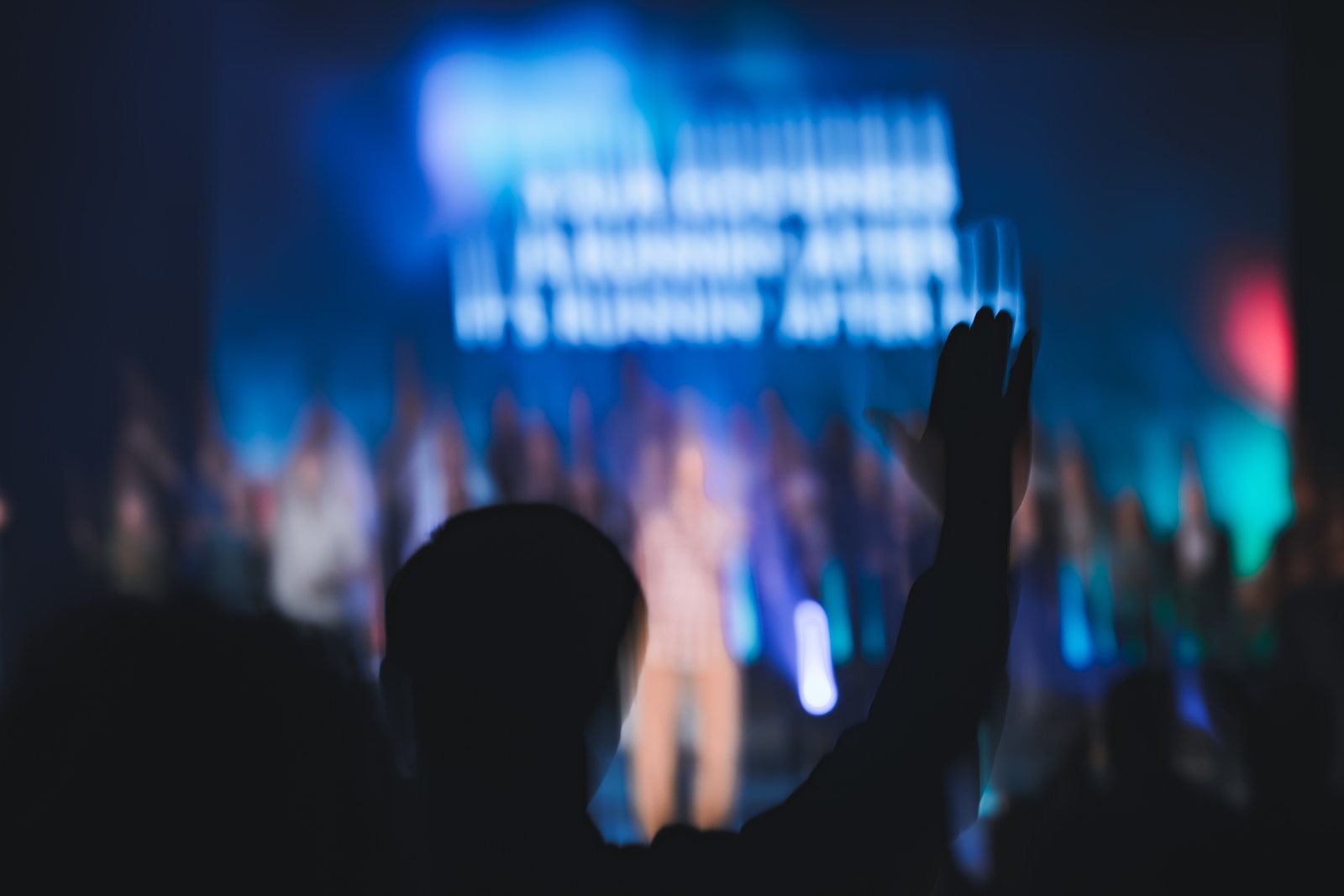 a crowd of people standing on top of a stage